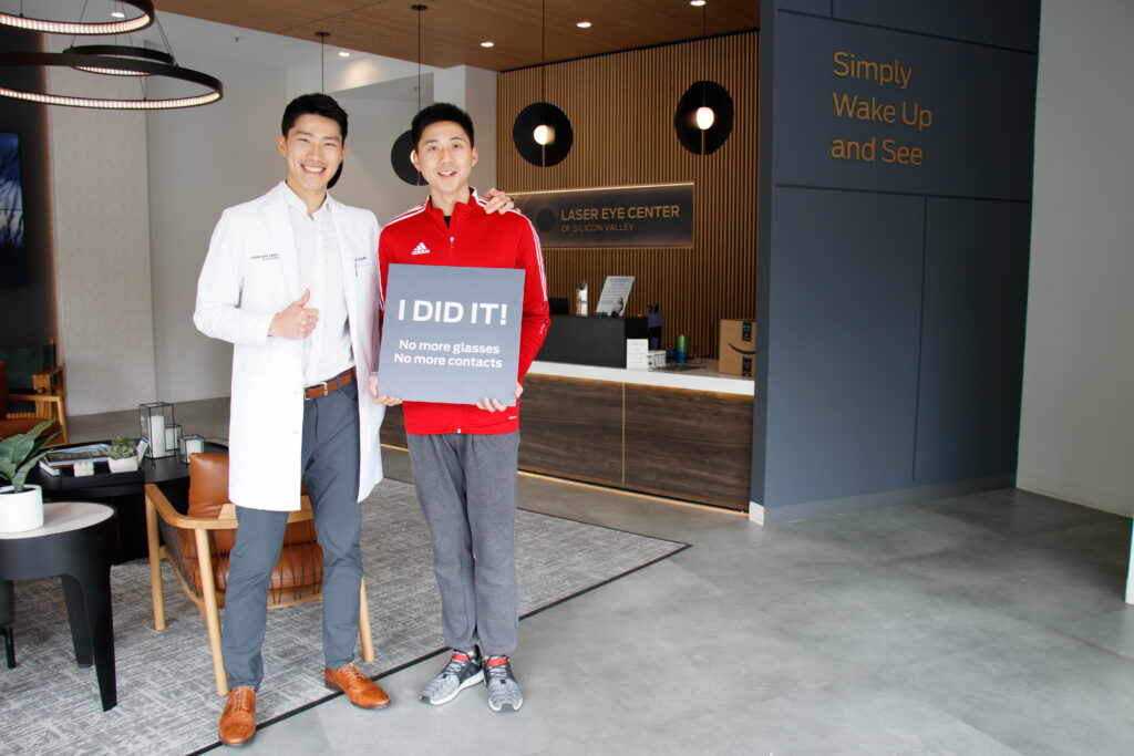 Dr. Joseph Ling smiling with patient post-surgery in Laser Eye Center of Silicon Valley's lobby