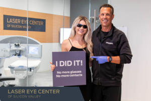 Dr. Craig Bindi of Laser Eye Center of Silicon Valley San Jose with patient post modern vision correction in front of laser room